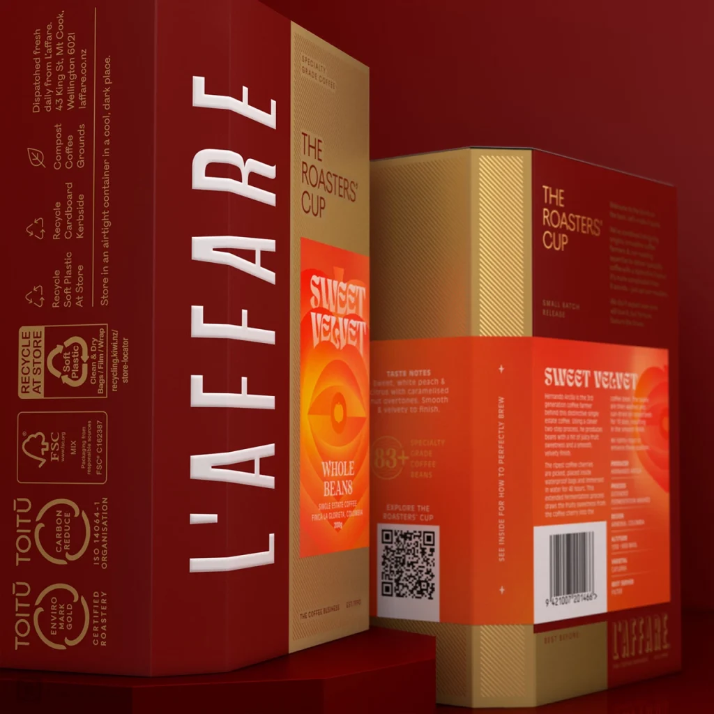 Two cardboard boxes of L'affare Sweet Velvet coffee, one showing the front and one showing the back.