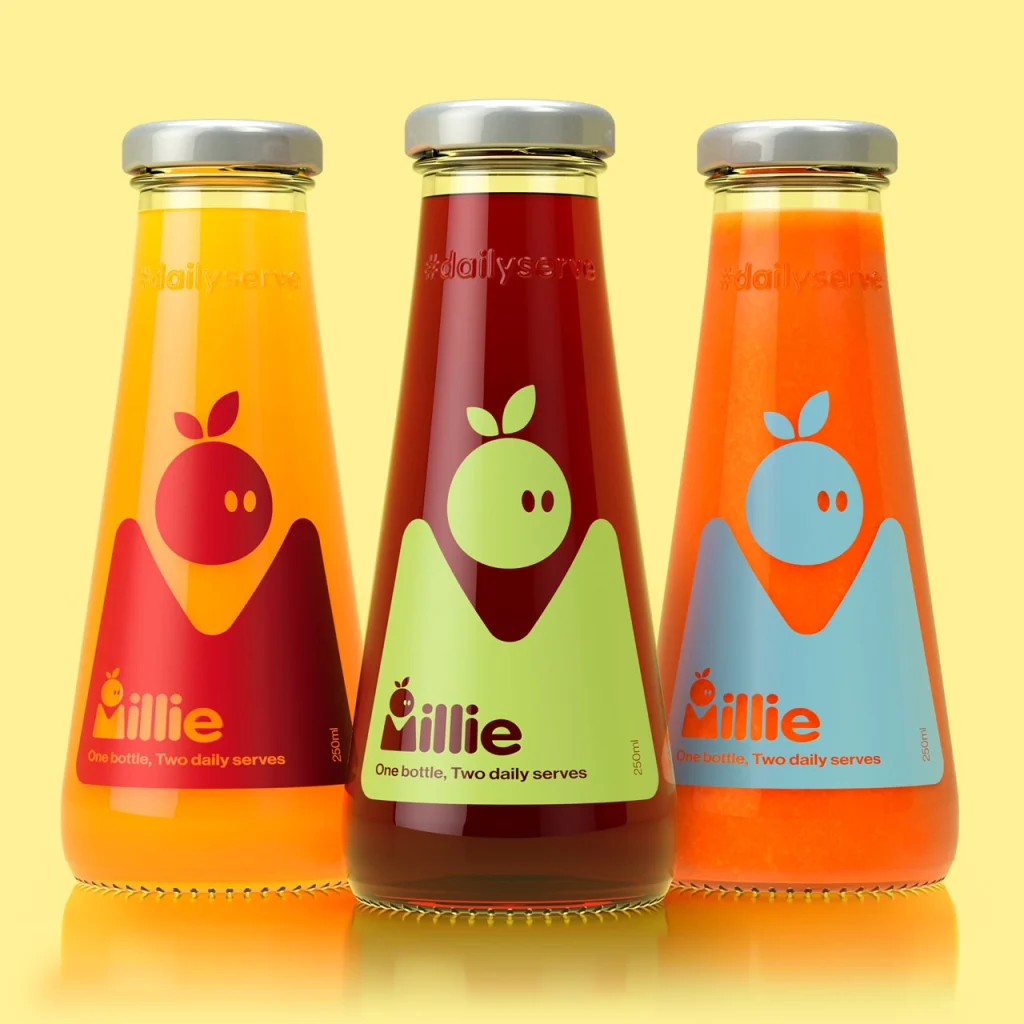 Three glass bottles of Millie bottle with in orange, yellow and red liquids.