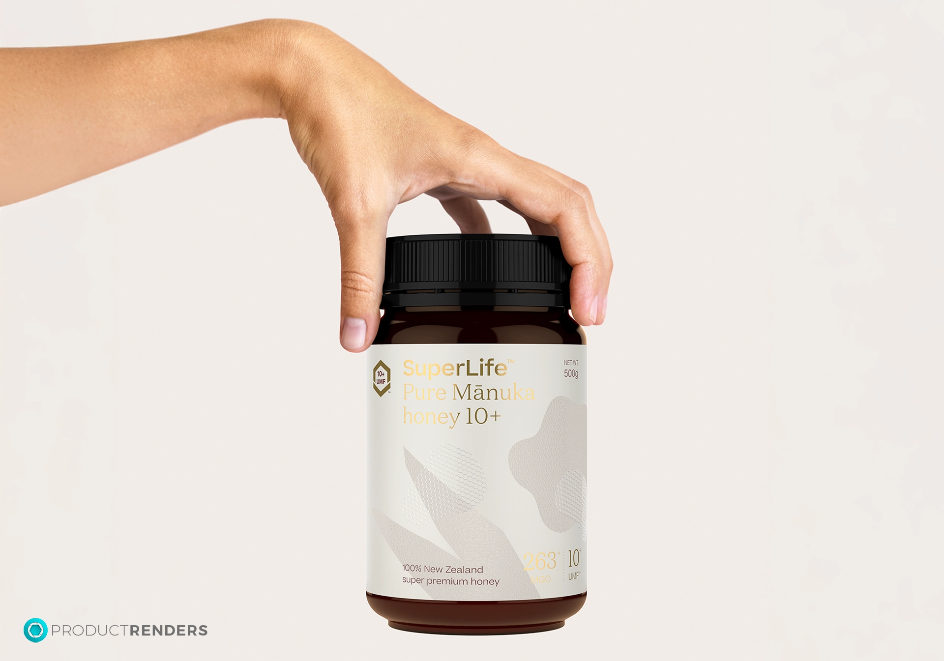 A hand holding a jar of SuperLife Pure Manuka Honey 10+.