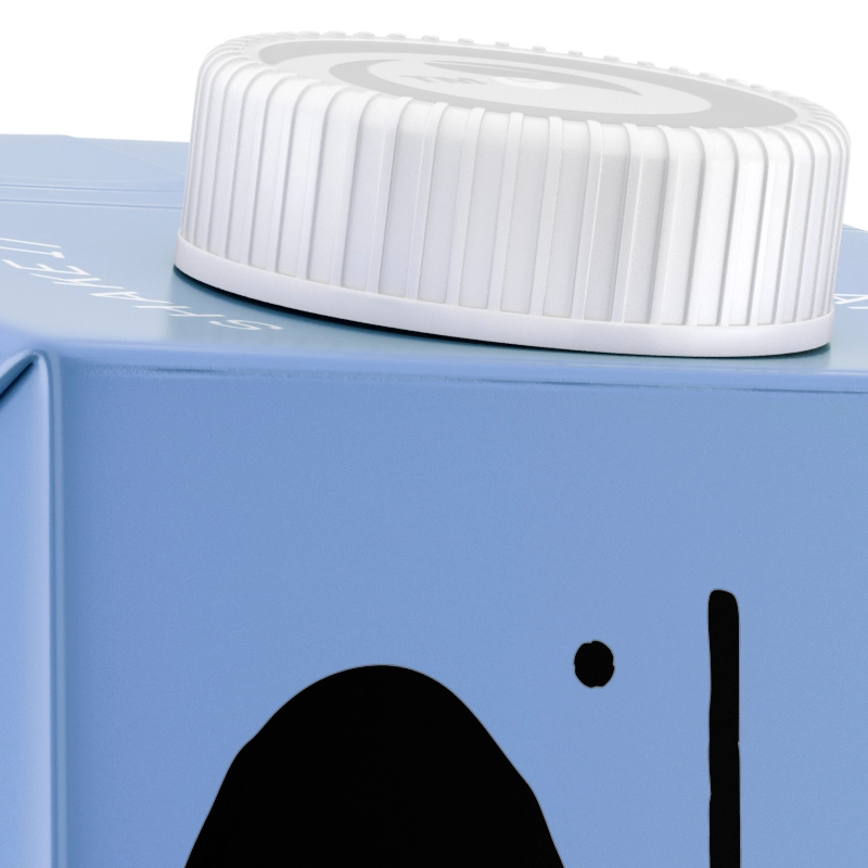 Closeup of a blue TetraPak carton of oat milk with a white screw-top lid.