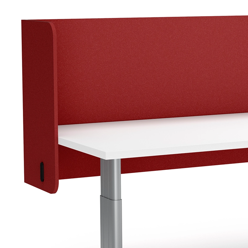 Closeup of a red desk divider attached to a white desk.