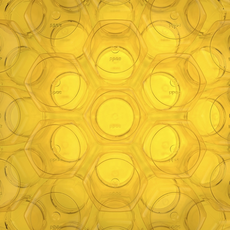 Closeup of a repeating pattern of hexagon-shaped objects with a yellow background.