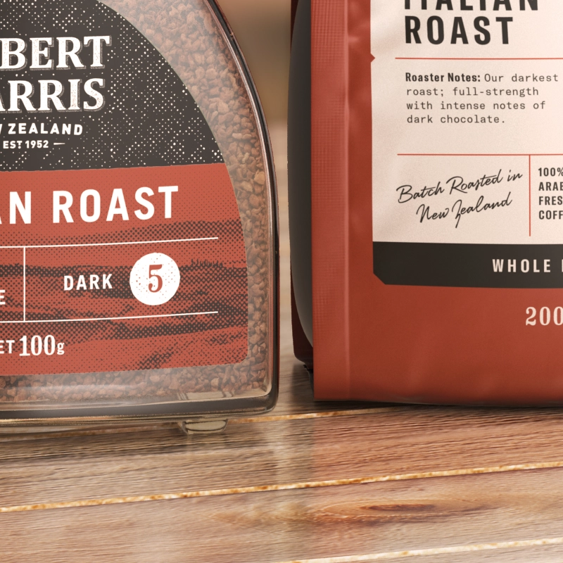 Closeup of Two bags of Robert Harris Italian Roast coffee, one in a jar and one in a pouch, with information about the roast and origin.