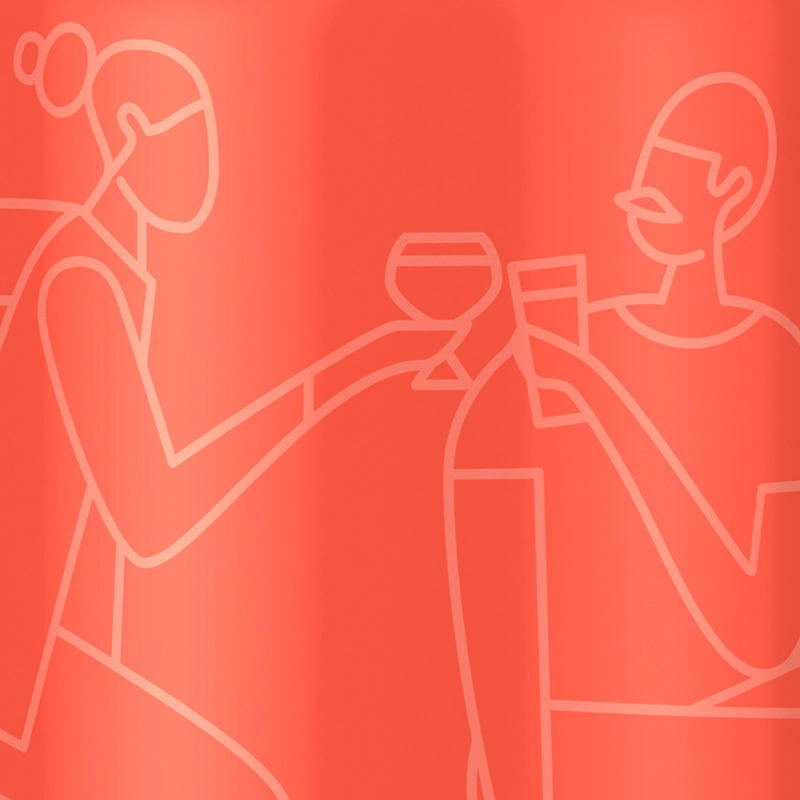 Closeup of two people toasting with drinks in front of a red background.