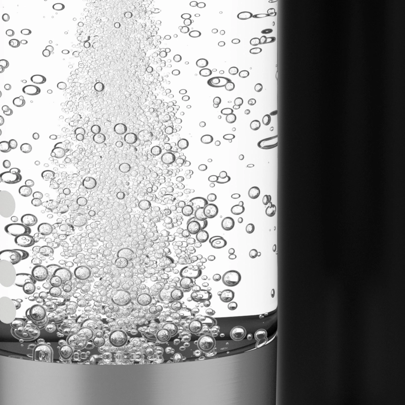 A close-up of a glass bottle with a silver cap, filled with a clear liquid and many small bubbles rising to the surface.