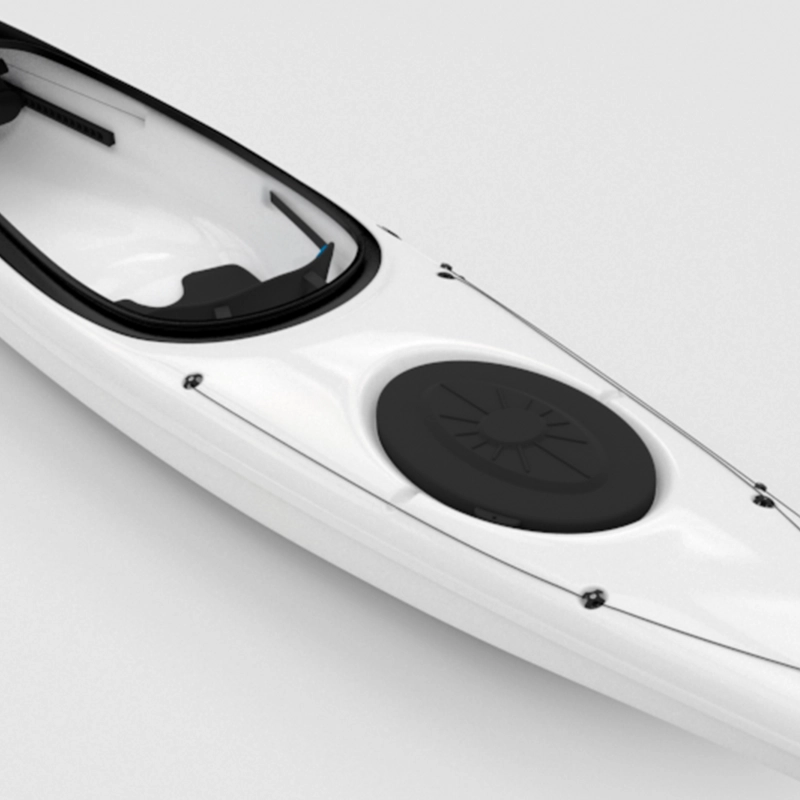 Closeup of a white kayak with a black seat and rudder on a white background.