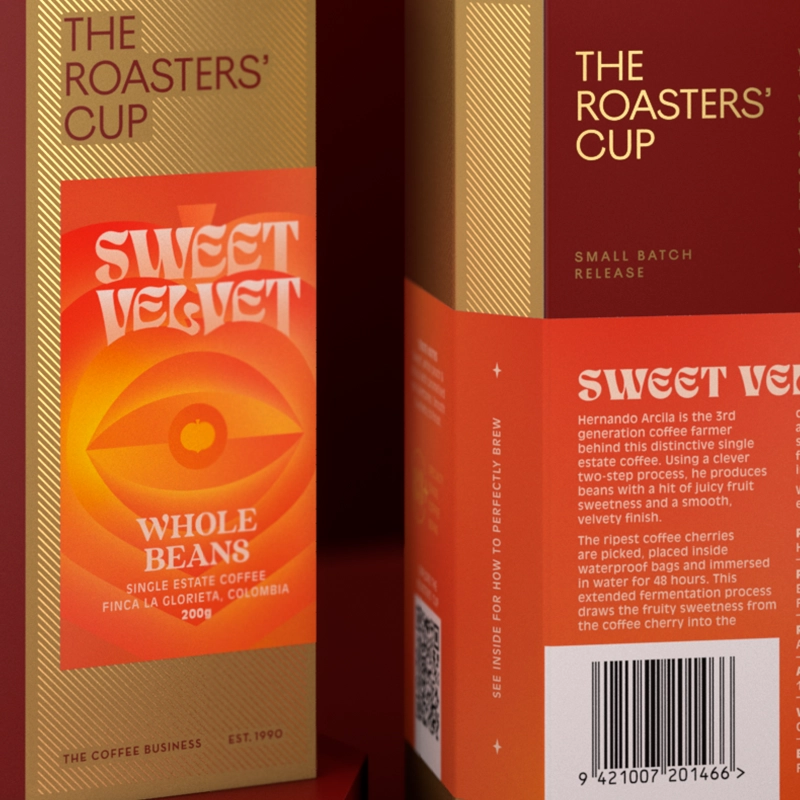 Two cardboard boxes of The Roasters' Cup Sweet Velvet coffee, one showing the front and one showing the back.