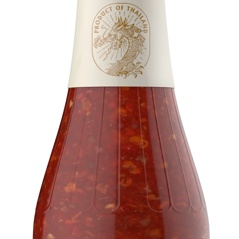 A glass bottle of Thai sweet chilli sauce with a dragon logo on the label.